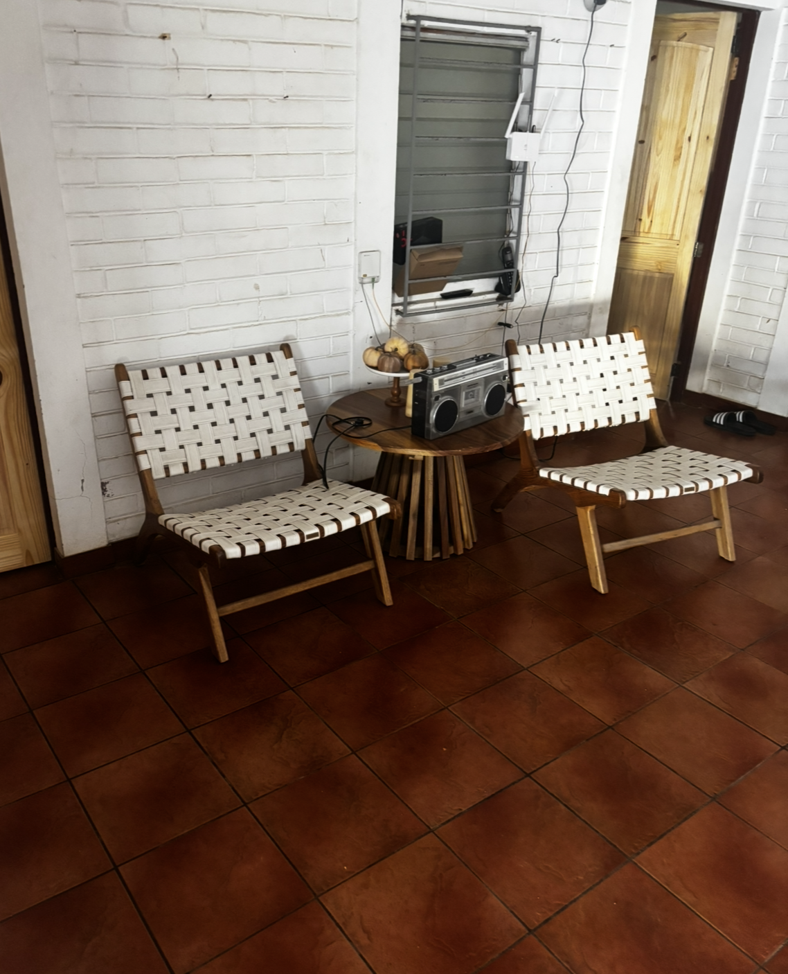 Wicker Lounge Chairs and Round Coffee Table with Boombox – Indoor Lounge at Oceanfrontsunsetvilla, La Libertad El Salvador